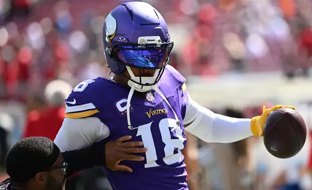 Minnesota Vikings wide receiver Justin Jefferson (18) warms up before an NFL football game against the Tampa Bay Buccaneers in Tampa, Fla., Sunday, Sept. 27, 2026. (AP Photo/Jason Behnken)