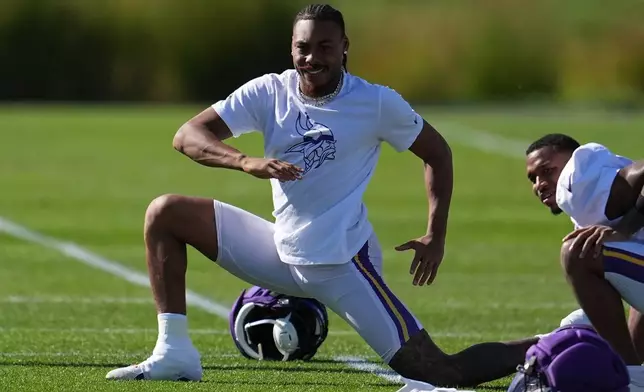 Minnesota Vikings wide receiver Justin Jefferson stretches during an NFL football practice Wednesday, Oct. 7, 2026, in Eagan, Minn. (AP Photo/Abbie Parr)