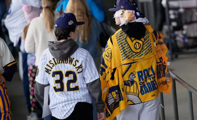 Milwaukee Brewers fans arrive for a rally during the baseball team's World Series parade, Friday, Oct. 30, 2026, in Milwaukee. (AP Photo/Nam Huh)