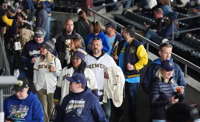 Milwaukee Brewers fans arrive for a rally during the baseball team's World Series parade, Friday, Oct. 30, 2026, in Milwaukee. (AP Photo/Nam Huh)