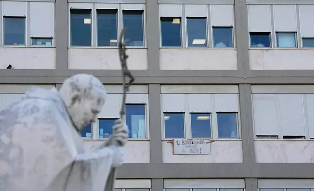 A banner reading "Ematology greets the pope" hangs from a window of the Agostino Gemelli Polyclinic where Pope Leo XIV is hospitalised, in Rome, Thursday, Oct. 15, 2026. (AP Photo/Alessandra Tarantino)