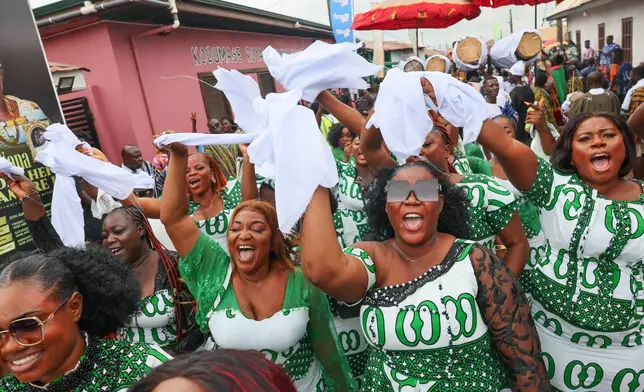 Women cheer on at the Akuapem State's 200th anniversary celebration of the Odwira Festival in Akropong, Ghana, Friday, Sept. 25, 2026. (AP Photo)