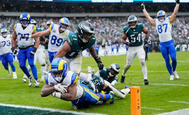 FILE - Los Angeles Rams running back Kyren Williams (23) scores a touchdown during the second half of an NFL football game against the Philadelphia Eagles in Philadelphia, Sunday, Oct. 4, 2026. (AP Photo/Chris Szagola, File)