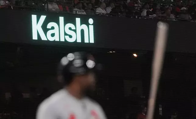 FILE - A Kalshi advertisement is displayed at Oracle Park during a baseball game between the San Francisco Giants and the St. Louis Cardinals, Tuesday, Sept. 8, 2026, in San Francisco. (AP Photo/Jeff Chiu, File)