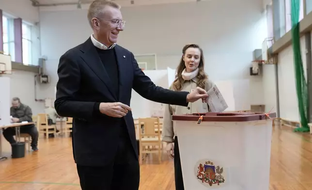 President of Latvia Edgars Rinkevics casts his ballot at the parliamentary election at a polling station in Riga, Latvia, Saturday, Oct. 3, 2026. (AP Photo/Roman Koksarov)