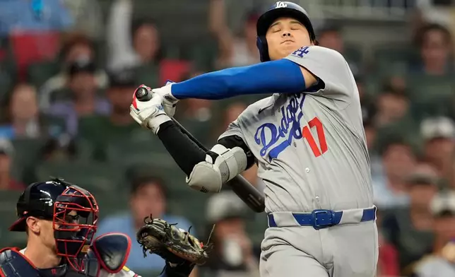 Los Angeles Dodgers two-way player Shohei Ohtani (17) strikes out during the fourth inning in Game 4 of baseball's National League Division Series against the Atlanta Braves, Wednesday, Oct. 7, 2026, in Atlanta. (AP Photo/Mike Stewart)