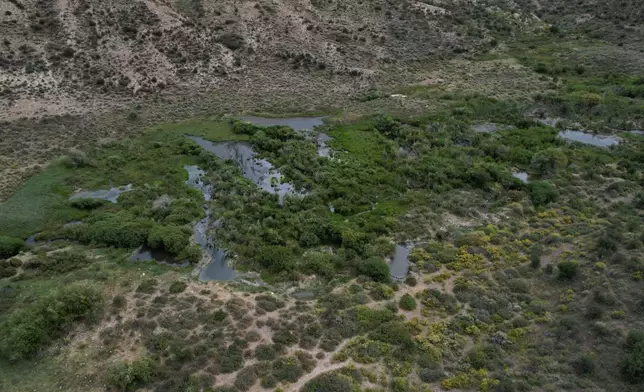 Water sits in Trout Creek, Thursday, Aug. 20, 2026, near Rock Springs, Wyo. (AP Photo/Brittany Peterson)