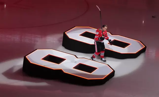 Chicago Blackhawks right wing Patrick Kane is introduced during the Blackhawks home opener against the St. Louis Blues in an NHL hockey game, Tuesday, Oct. 6, 2026, in Chicago. (AP Photo/David Banks)