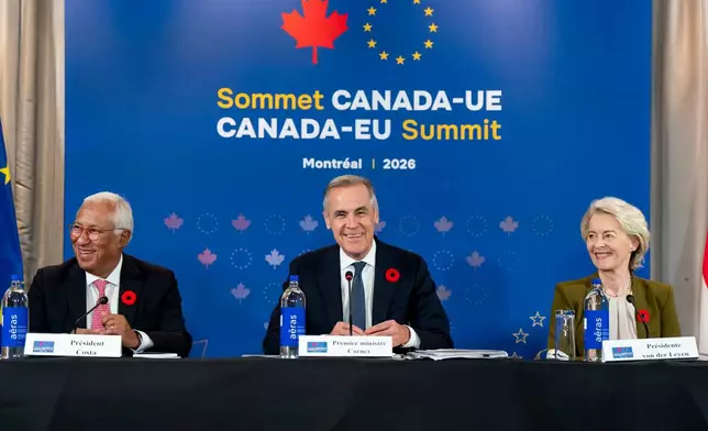 Prime Minister Mark Carney, centre, gives remarks alongside, President of the European Council, Antonio Costa, left, and President of the European Commission, Ursula von der Leyen, at a roundtable with business leaders during the Canada-EU Summit, in Montreal, on Thursday, Oct. 29, 2026. (Christopher Katsarov/The Canadian Press via AP)