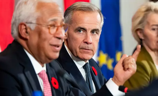 Canada's Prime Minister Mark Carney, right, looks on as President of the European Council Antonio Costa gives remarks at a roundtable with business leaders during the Canada-EU Summit in Montreal, Thursday, Oct. 29, 2026. (Christopher Katsarov/The Canadian Press via AP)