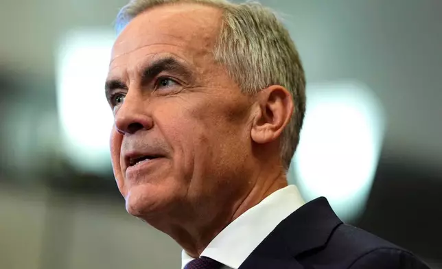 Canada Prime Minister Mark Carney and Ontario Premier Doug Ford, not shown, participate in a joint news conference on Parliament Hill in Ottawa, on Wednesday, Oct. 21, 2026. (Justin Tang/The Canadian Press via AP)