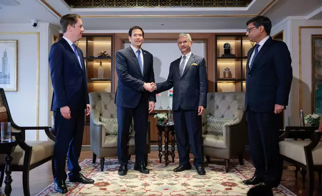 US Secretary of State Marco Rubio, center left, shakes hands with India's Foreign Minister Subrahmanyam Jaishankar, center right, before their meeting in Mumbai, India, Tuesday, Oct. 20, 2026. (Kylie Cooper/Pool Photo via AP)