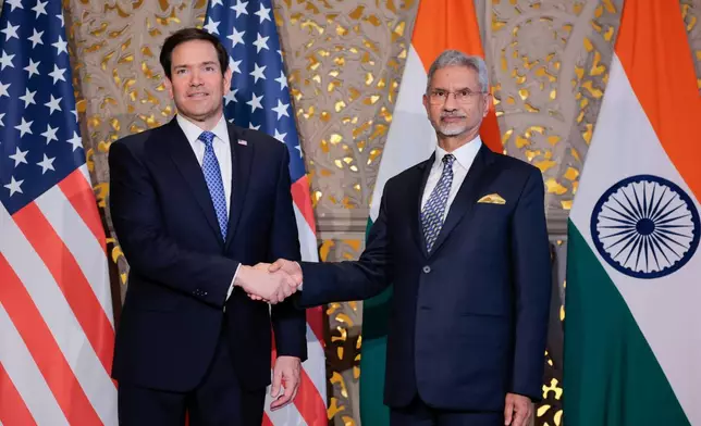 US Secretary of State Marco Rubio, left, shakes hands with India's Foreign Minister Subrahmanyam Jaishankar, right, before their meeting in Mumbai, India, Tuesday, Oct. 20, 2026. (Kylie Cooper/Pool Photo via AP)