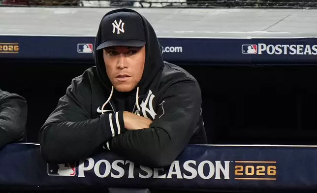 New York Yankees' Aaron Judge stands in the dugout watching play against the Tampa Bay Rays during the second inning in Game 3 of baseball's American League Division Series, Wednesday, Oct. 7, 2026, in New York. (AP Photo/Seth Wenig)