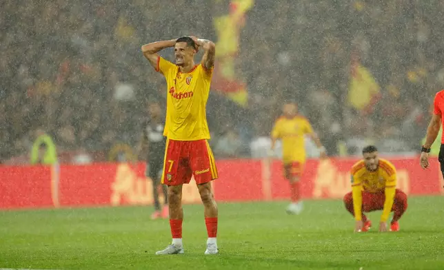 Lens' Florian Sotoca reacts during the French League One soccer match between Lens and Lyon, in Lens, France, Friday, Oct. 9, 2026. (AP Photo/Jean-Francois Badias)
