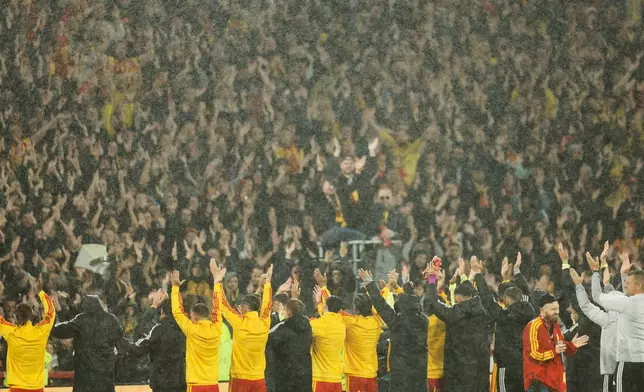 Lens players applaud to their fans after the French League One soccer match between Lens and Lyon, in Lens, France, Friday, Oct. 9, 2026. (AP Photo/Jean-Francois Badias)