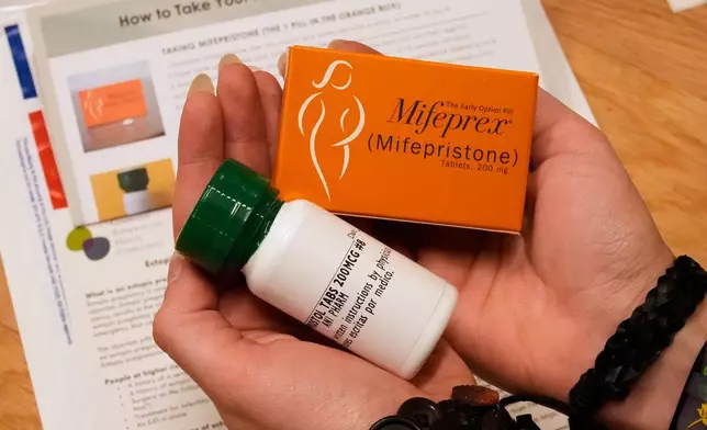 FILE - A coordinator shows the medications and care kit sent out the clients at the Massachusetts Medication Abortion Access Project, May 13, 2025, in Somerville, Mass. (AP Photo/Charles Krupa, File)