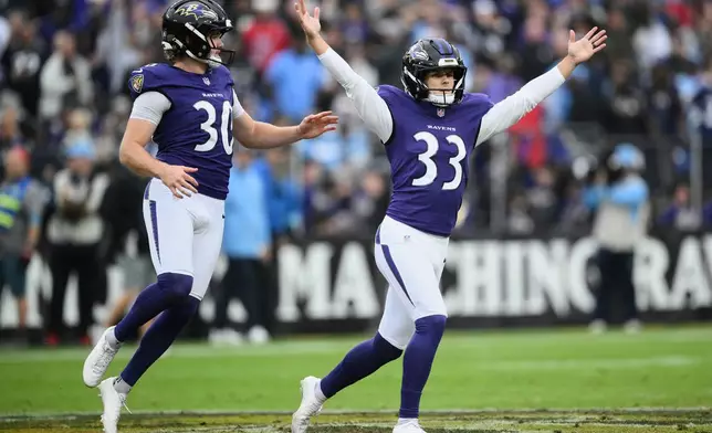 Baltimore Ravens place-kicker Tyler Loop (33) celebrates his 64-yard field goal with punter Ryan Eckley (30) during the first half of an NFL football game against the Tennessee Titans in Baltimore, Sunday, Oct. 4, 2026. (AP Photo/Nick Wass)