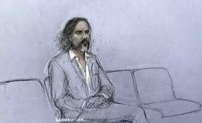 This court artist sketch by Elizabeth Cook shows Russell Brand appearing during jury selection at Southwark Crown Court in London, Monday Oct. 12, 2026. (Elizabeth Cook/PA via AP)