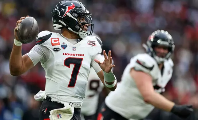 Houston Texans quarterback C.J. Stroud (7) makes a pass during an NFL football game against Jacksonville Jaguars in London, Sunday, Oct. 18, 2026. (AP Photo/Ian Walton)