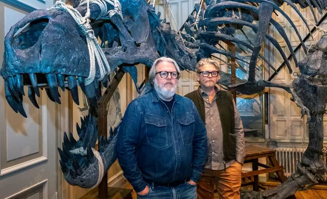 Dutch taxidermists Jaap Sinke, left, and Ferry van Tongeren pose for a photo at the Art Zoo in Amsterdam, Netherlands, on Oct. 27, 2026. (AP Photo/Patrick Post)