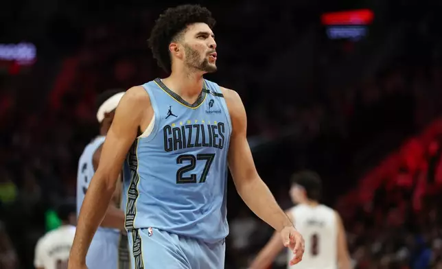 Memphis Grizzlies forward Cameron Boozer (27) reacts during the second half of an NBA basketball game against the Portland Trail Blazers Thursday, Oct. 29, 2026, in Portland, Ore. (AP Photo/Amanda Loman)