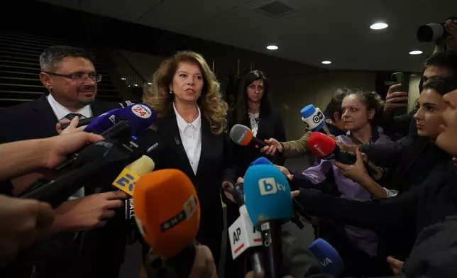Incumbent President and presidential candidate Iliana Yotova speaks to journalists after polls close in Sofia, Bulgaria, Sunday, Oct. 25, 2026. (AP Photo/Valentina Petrova)