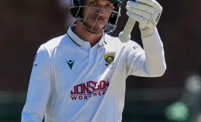 South Africa's Marco Jansen celebrates his 50 runs on day three of the second cricket test match between South Africa and Australia, in Gqeberha, South Africa, Tuesday, Oct. 20, 2026. (AP Photo/Themba Hadebe)