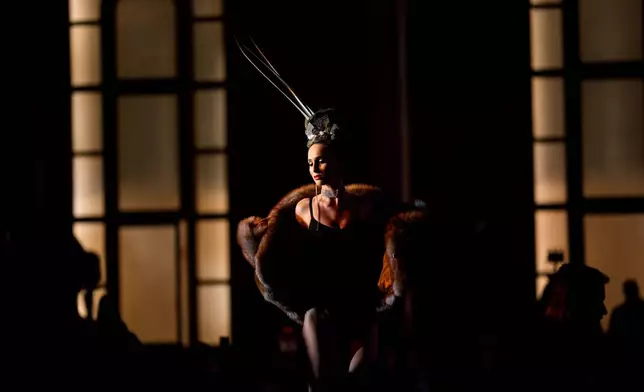 A model walks on the catwalk during the Atypic Beauty Gala fashion show, an event promoting inclusion and equal opportunities for people with disabilities, in Bucharest, Romania, Thursday, Oct. 22, 2026. (AP Photo/Andreea Alexandru)