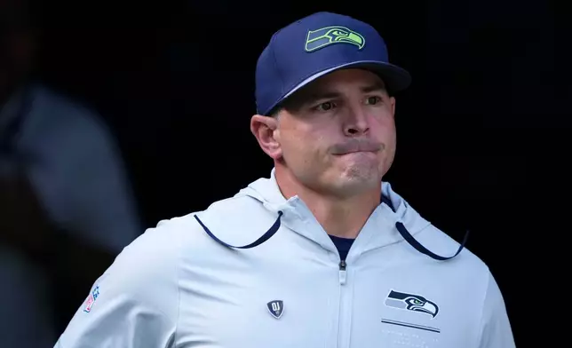 Seattle Seahawks head coach Mike Macdonald runs onto the field before an NFL football game against the Los Angeles Chargers, Sunday, Oct. 4, 2026, in Seattle. (AP Photo/Lindsey Wasson)