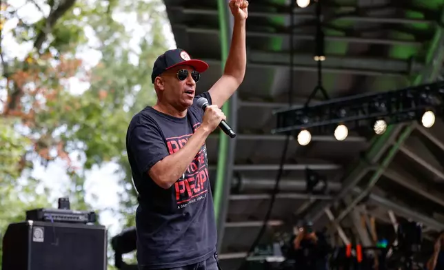 Tom Morello announces the first act of the day during the Power To The People Festival on Saturday, Oct. 3, 2026, in Columbia, Md. (AP Photo/Alyssa Piazza)