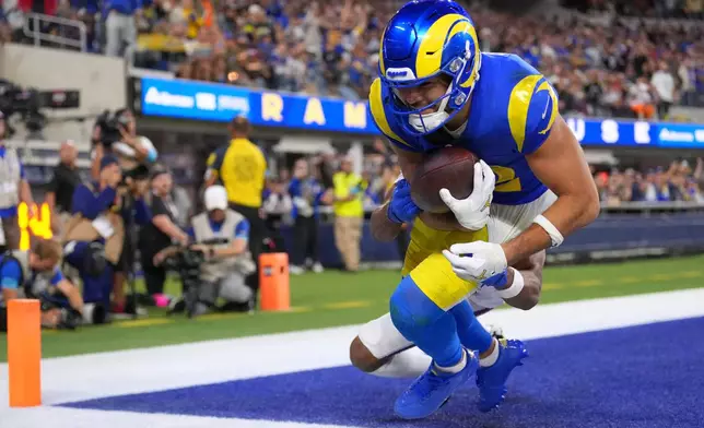 Los Angeles Rams wide receiver Puka Nacua falls after making a touchdown catch during the second half of an NFL football game against the Buffalo Bills, Monday, Oct. 12, 2026, in Inglewood, Calif. (AP Photo/Scott Strazzante)