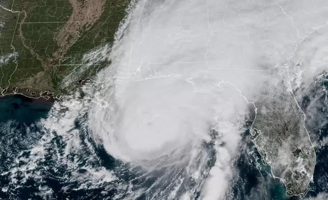 This GOES-19 GeoColor satellite image provided by the National Oceanic and Atmospheric Administration (NOAA) and taken at 1:06 p.m. EDT, Friday, Oct. 9 2026, shows Hurricane Isaias approaching the Gulf Coast of Alabama and Florida . (NOAA via AP)