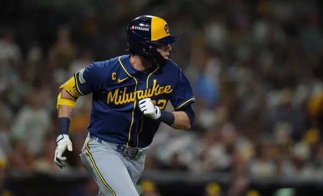 Milwaukee Brewers' Christian Yelich singles during the second inning in Game 3 of baseball's National League Division Series against the San Diego Padres Tuesday, Oct. 6, 2026, in San Diego. (AP Photo/Gregory Bull)
