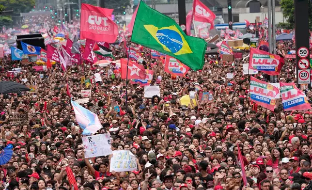 Supporters of Brazilian President Luiz Inacio Lula da Silva attend his reelection campaign rally ahead of the presidential runoff vote in Sao Paulo, Sunday, Oct. 11, 2026. (AP Photo/Andre Penner)