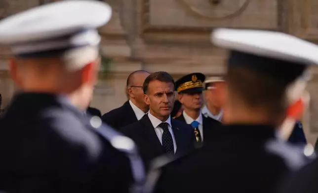 French President Emmanuel Macron meets with police officers in Marseille, France, Monday, Oct. 26, 2026. (Aurelien Morissard/Pool Photo via AP)