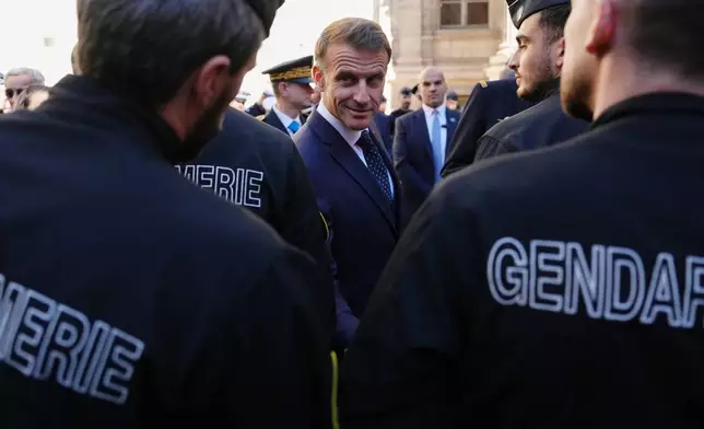 French President Emmanuel Macron meets with police officers in Marseille, France, Monday, Oct. 26, 2026. (AP Photo/Aurelien Morissard, Pool)
