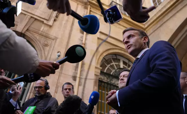 French President Emmanuel Macron addresses the media in Marseille, France, Monday, Oct. 26, 2026. (AP Photo/Aurelien Morissard, Pool)
