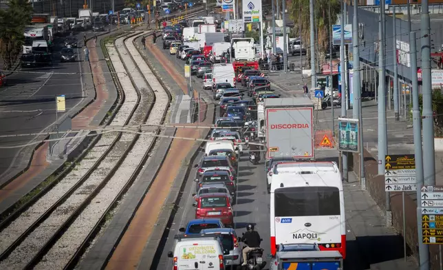 Trucks are parked along the street during a truckers' protest in Naples, Italy, over high fuel prices, Tuesday, Oct. 20, 2026. (Alessandro Garofalo/LaPresse via AP)