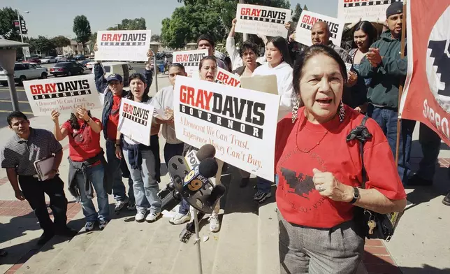 FILE - Dolores Huerta, co-founder of the United Farmworkers of America, along with local college students stage a rally supporting candidate Gray Davis for governor of California, Oct. 17, 1998 at East Los Angeles College in Los Angeles. (AP Photo/E.J. Flynn, File)