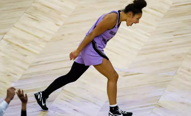 Golden State Valkyries guard Veronica Burton (22) celebrates after scoring a three-pointer against Las Vegas Aces during Game 2 of the WNBA semifinals in San Francisco, Wednesday, Oct. 7, 2026. (Yalonda M. James/San Francisco Chronicle via AP)