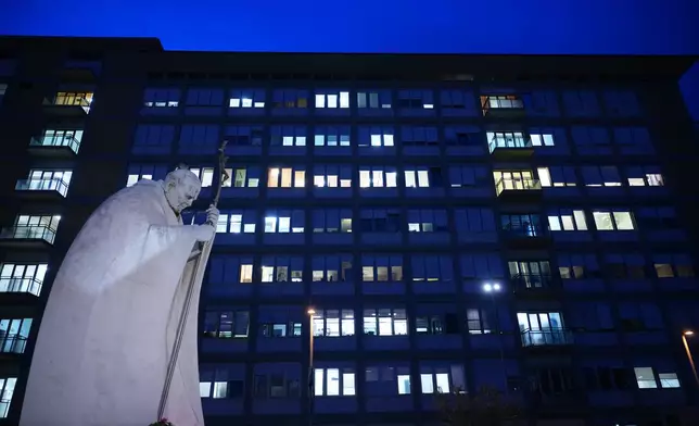 The statue of late Pope John Paul II is pictured at the Agostino Gemelli Polyclinic where Pope Leo XIV is scheduled to be hospitalized, in Rome, in Rome, Monday, Oct. 12, 2026. (AP Photo/Andrew Medichini)