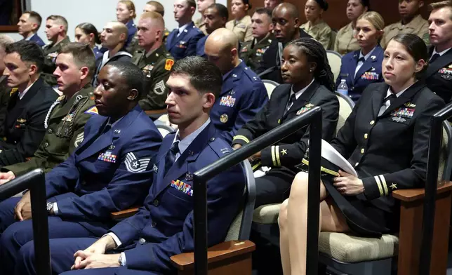 Members of the military listen as Secretary of Defense Pete Hegseth gives a State of the Force address at Marine Corps Base Quantico, Wednesday, Sept. 30, 2026 in Quantico, Va. (Alex Wong/Pool Photo via AP)