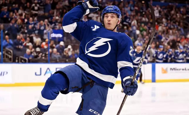 Tampa Bay Lightning right wing Pontus Holmberg celebrates after his goal during the second period of an NHL hockey game against the Philadelphia Flyers, Monday, Oct. 5, 2026, in Tampa, Fla. (AP Photo/Jason Behnken)