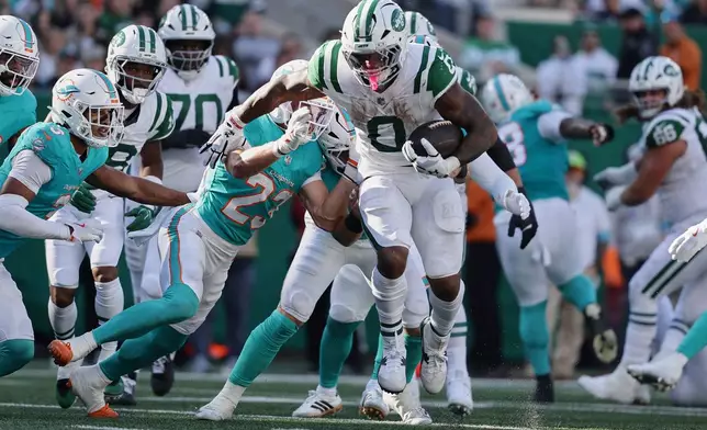 New York Jets running back Braelon Allen (0) carries against the Miami Dolphins in the second half of an NFL football game in East Rutherford, N.J., Sunday, Oct. 25, 2026. (AP Photo/Adam Hunger)