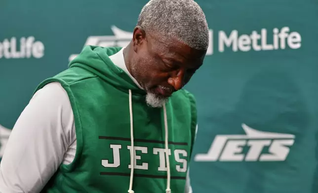 New York Jets head coach Aaron Glenn leaves after a news conference after the Miami Dolphins defeated the Jets in an NFL football game in East Rutherford, N.J., Sunday, Oct. 25, 2026. (AP Photo/Adam Hunger)