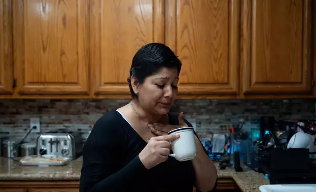 Cindy Banda drinks a home remedy after experiencing side effects from the targeted therapy pill Kisqali, Sept. 16, 2026, at her house in McAllen, Texas. (AP Photo/Julia Demaree Nikhinson)