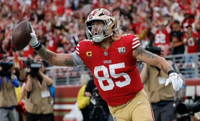 San Francisco 49ers tight end George Kittle (85) celebrates after scoring against the Washington Commanders during the first half of an NFL football game in Santa Clara, Calif., Monday, Oct. 19, 2026. (AP Photo/Kelley L. Cox)