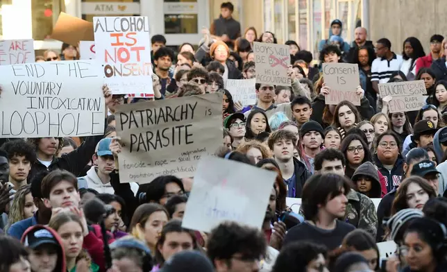 Demonstrators attend a protest against Cornell University's handling of the 2024 fraternity-house gang rape allegations at the campus, Monday, Oct. 5, 2026, in Ithaca, N.Y. (AP Photo/Adrian Kraus)