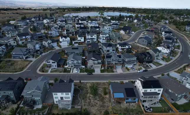A neighborhood rebuilt after the Marshall Fire is seen from the air Monday, Sept. 21, 2026, in Louisville, Colo. (AP Photo/Brittany Peterson)